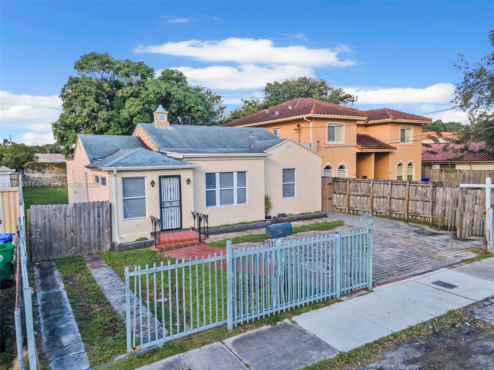 2811 Southwest 3rd Street Miami, FL 33135 - Photo 6 of 40 a front view of house with deck and yard