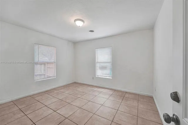 a view of an empty room and window