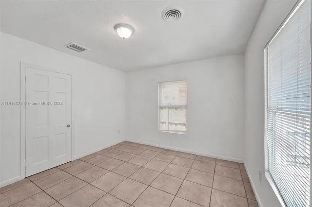 a view of an empty room and window