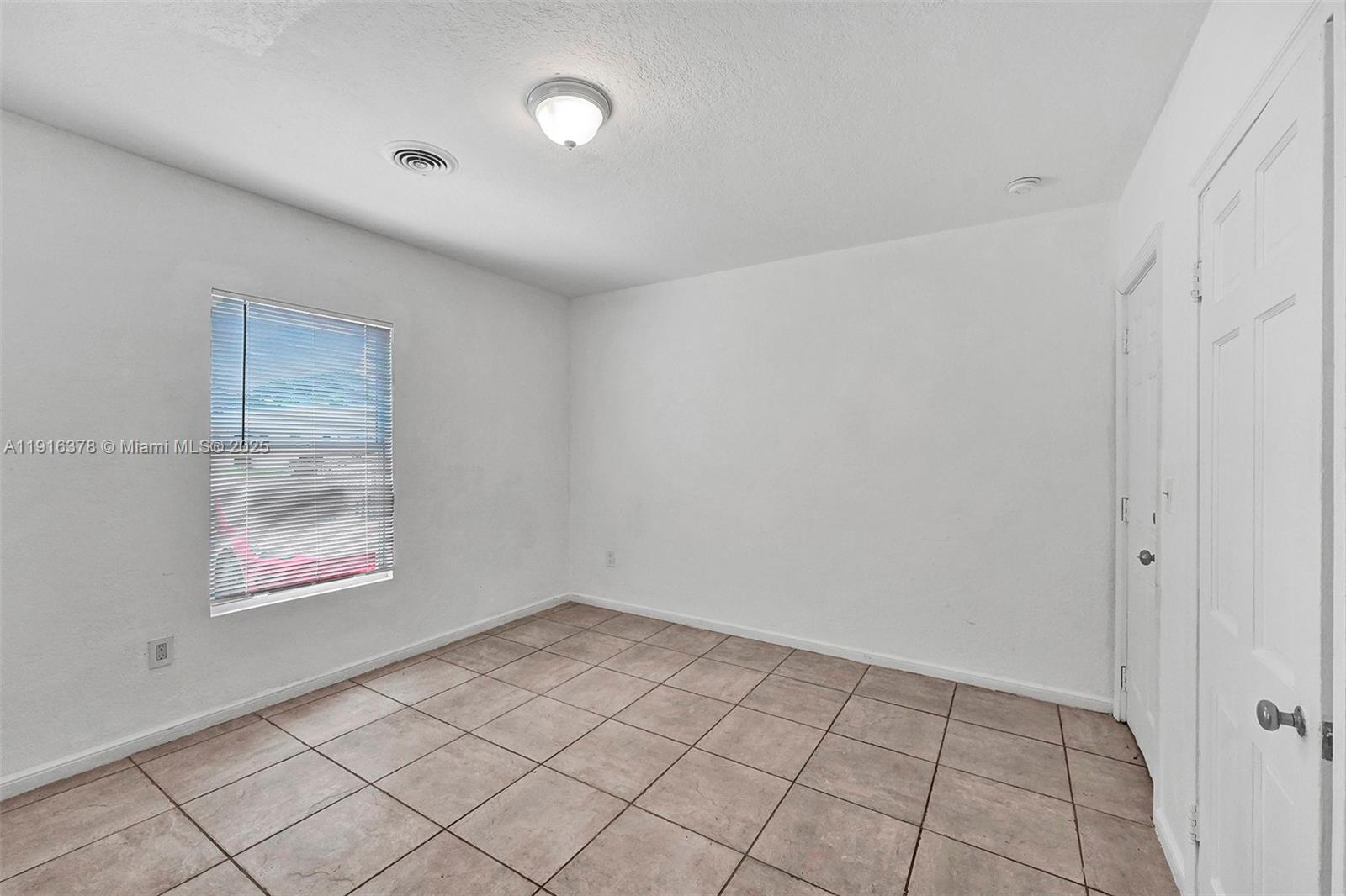 2811 Southwest 3rd Street Miami, FL 33135 - Photo 9 of 40 an empty room with windows