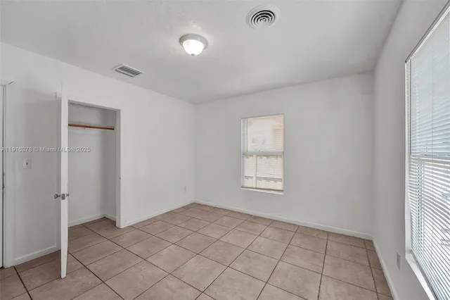 a view of an empty room and window