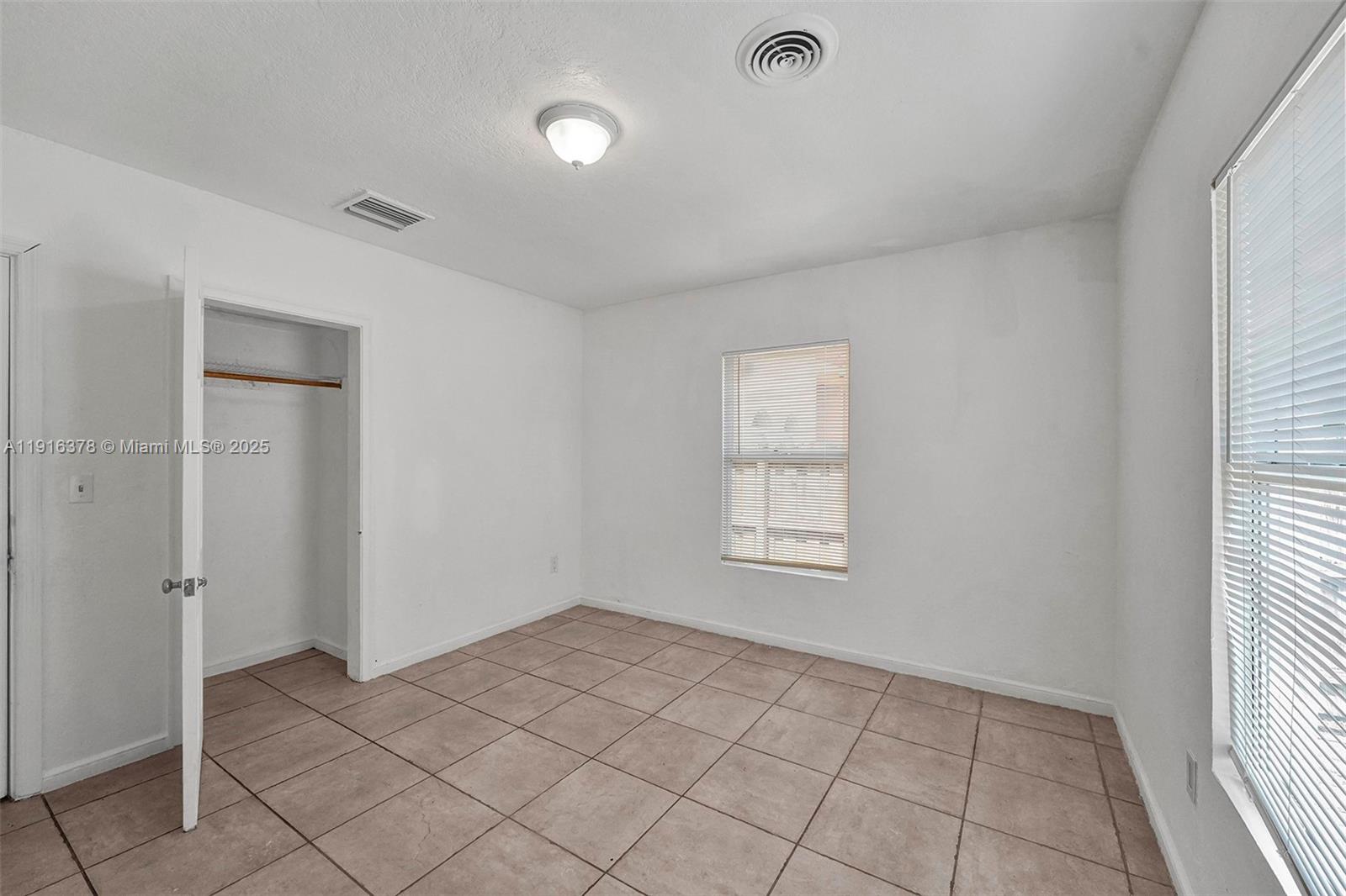 2811 Southwest 3rd Street Miami, FL 33135 - Photo 10 of 40 a view of an empty room and window