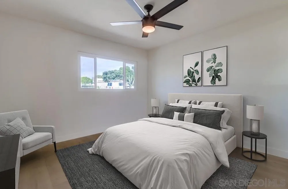 923 Melba Road Encinitas, CA 92024 - Photo 11 of 28 a bedroom with a bed and a painting on the wall