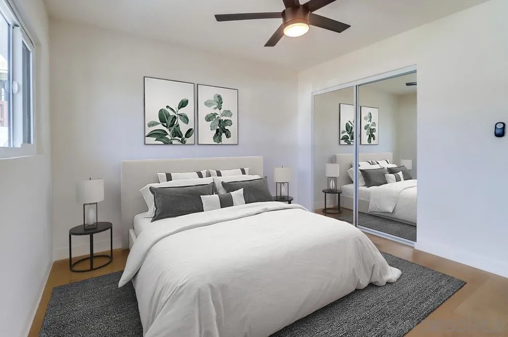 923 Melba Road Encinitas, CA 92024 - Photo 12 of 28 a bedroom with a bed and a painting on the wall