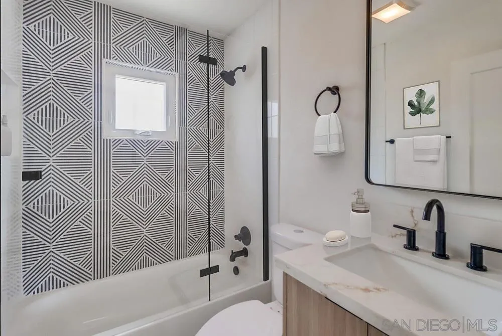 923 Melba Road Encinitas, CA 92024 - Photo 13 of 28 a bathroom with a sink toilet and shower
