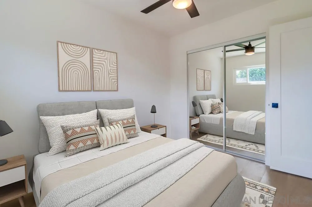 923 Melba Road Encinitas, CA 92024 - Photo 14 of 28 a bedroom with a bed and a painting on the wall