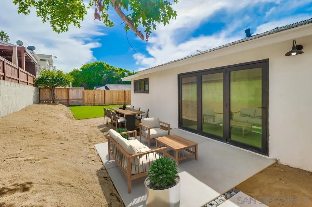 923 Melba Road Encinitas, CA 92024 - Photo 18 of 28 a view of a patio with couches table and chairs and potted plants