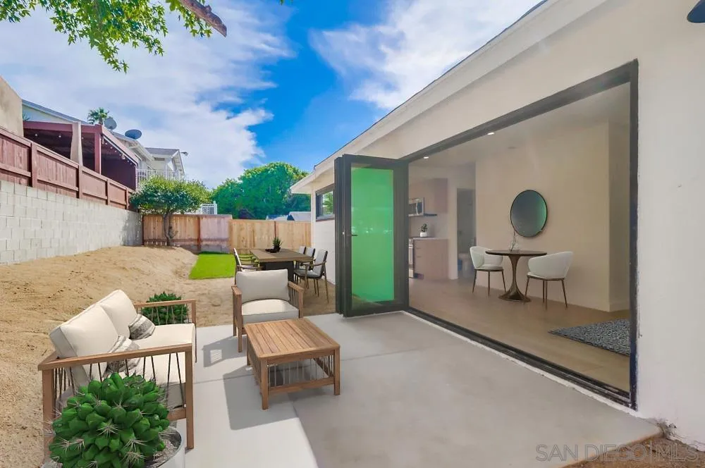 923 Melba Road Encinitas, CA 92024 - Photo 19 of 28 a backyard of a house with table and chairs
