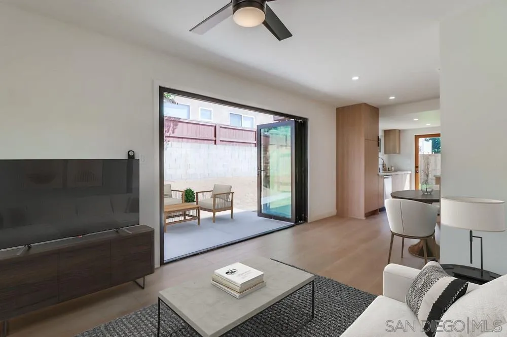 923 Melba Road Encinitas, CA 92024 - Photo 21 of 28 a living room with furniture and a large window