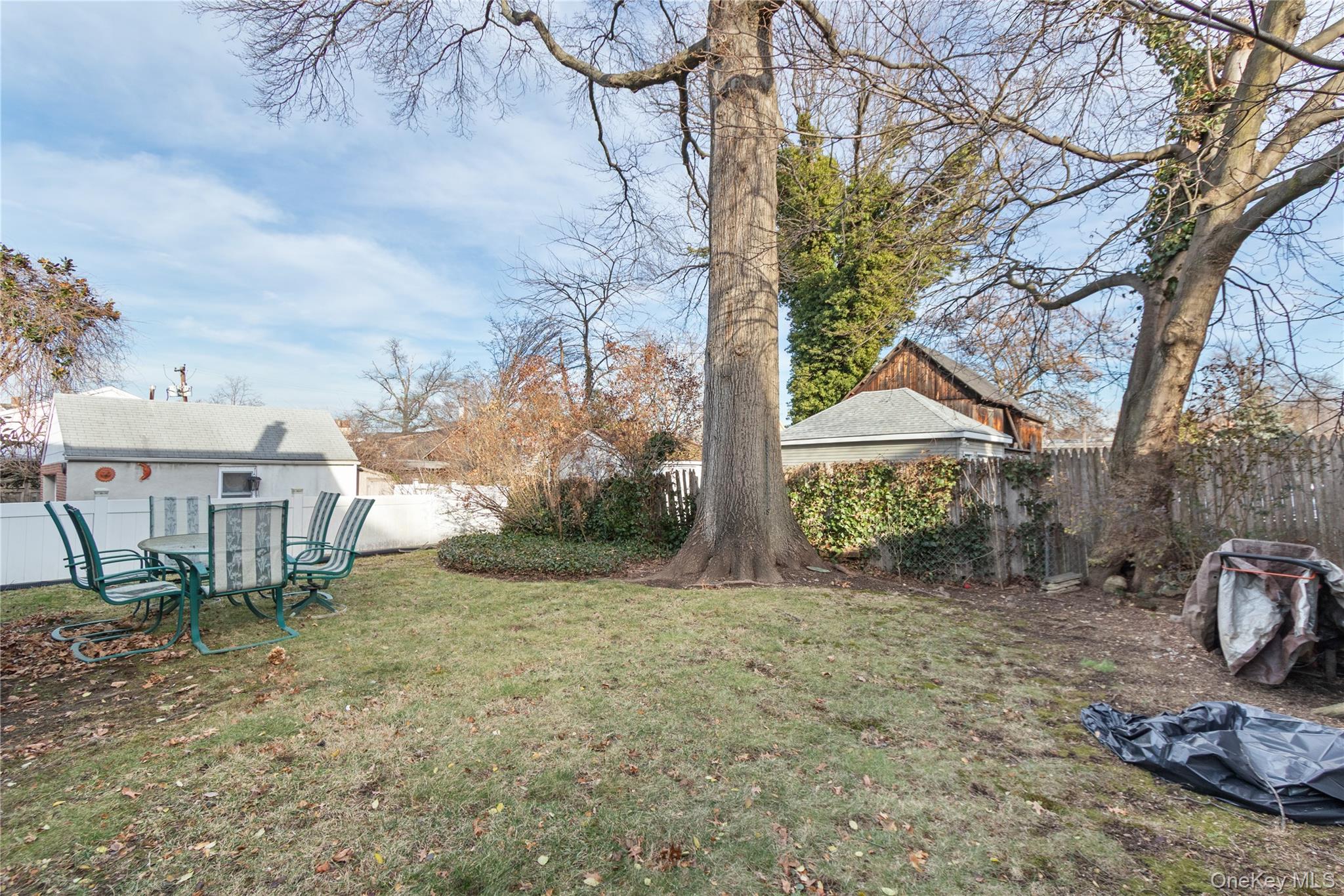 57 Spring Street, Unit 1 Oyster Bay, NY 11771 - Photo 10 of 11 a view of a house with a yard