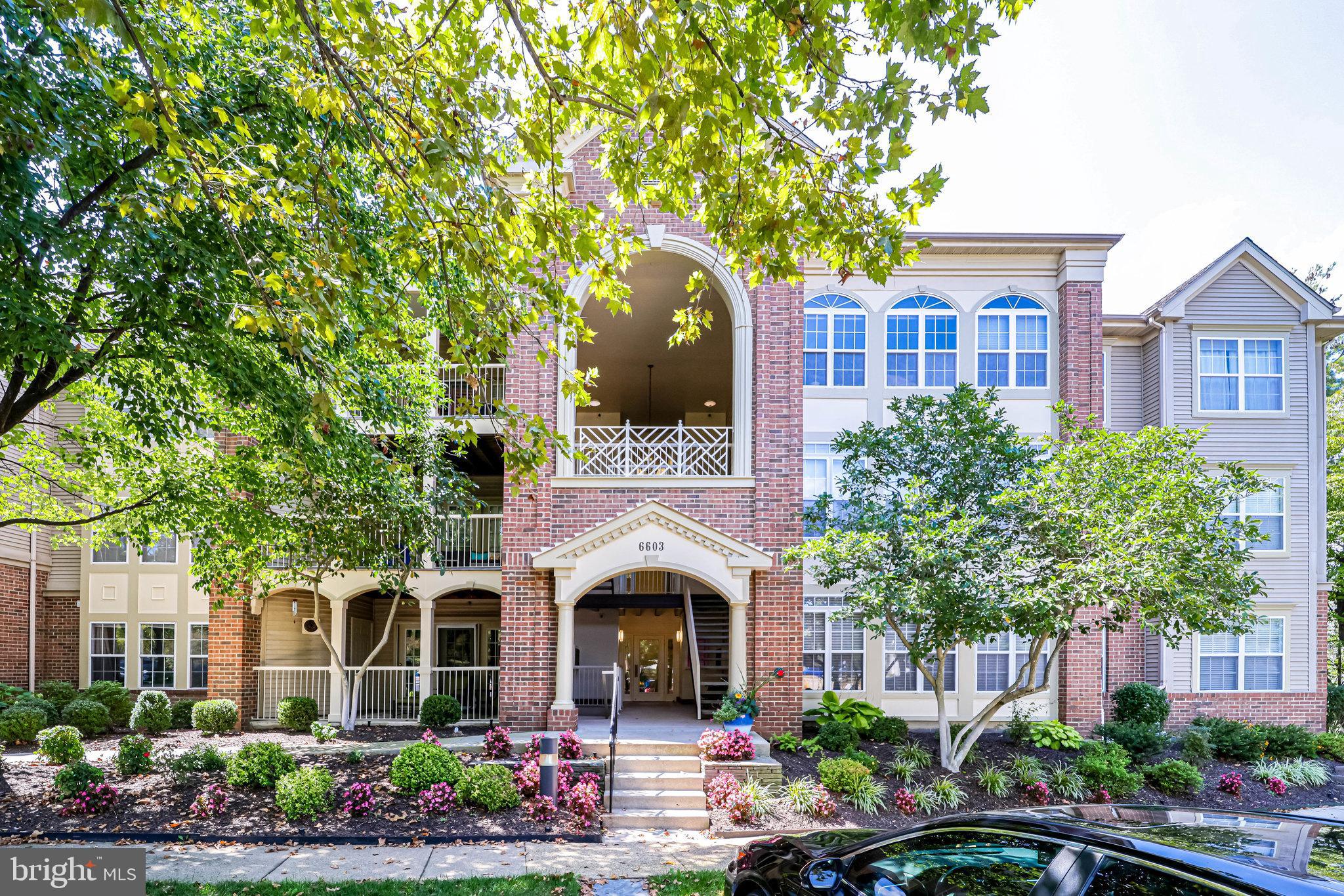 6603 C Thackwell Way, Unit 4C Alexandria, VA 22315 - Photo 1 of 22 a front view of a house with a garden