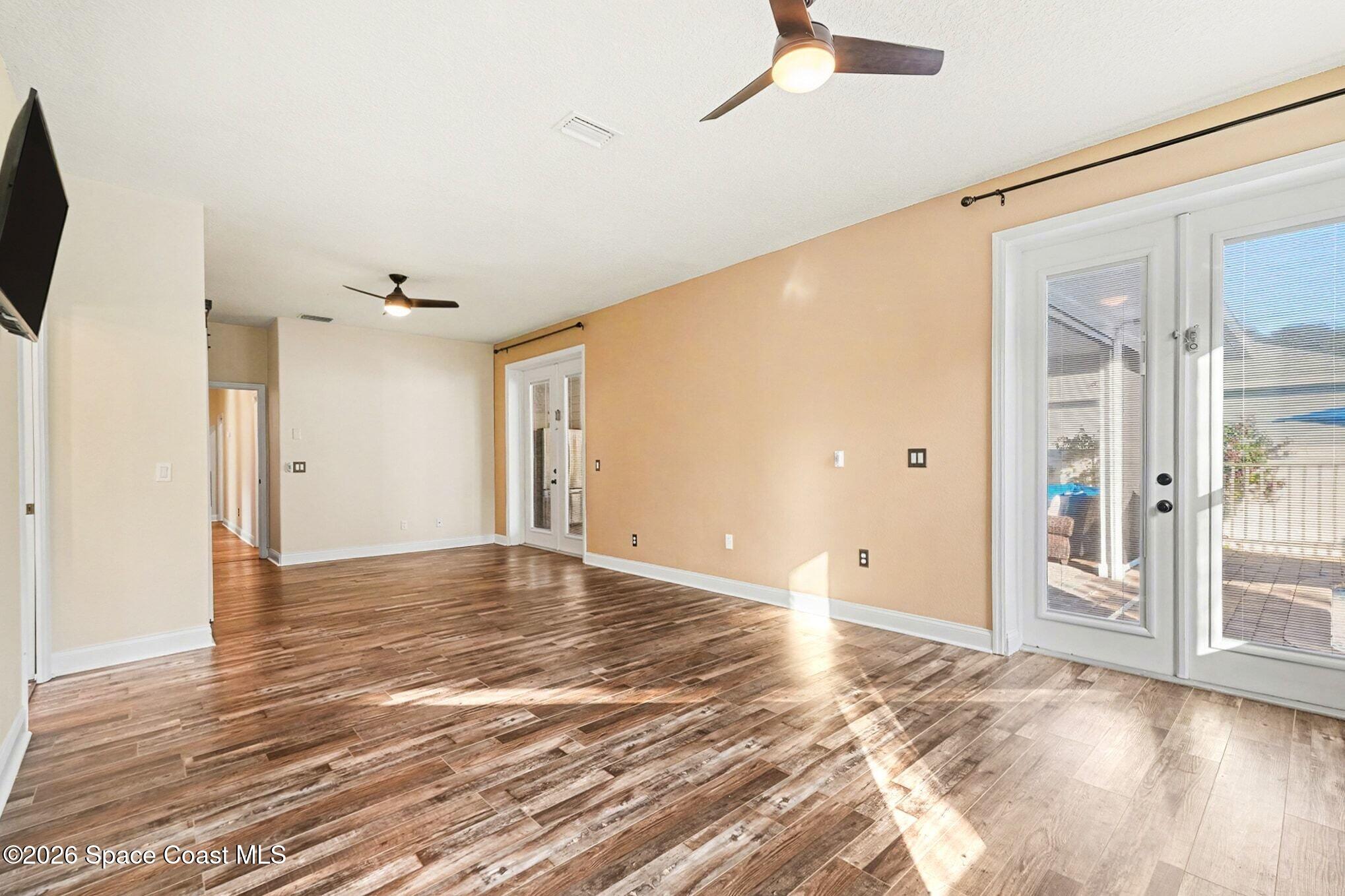 1355 Dalbora Road Merritt Island, FL 32953 - Photo 11 of 37 a view of empty room with wooden floor