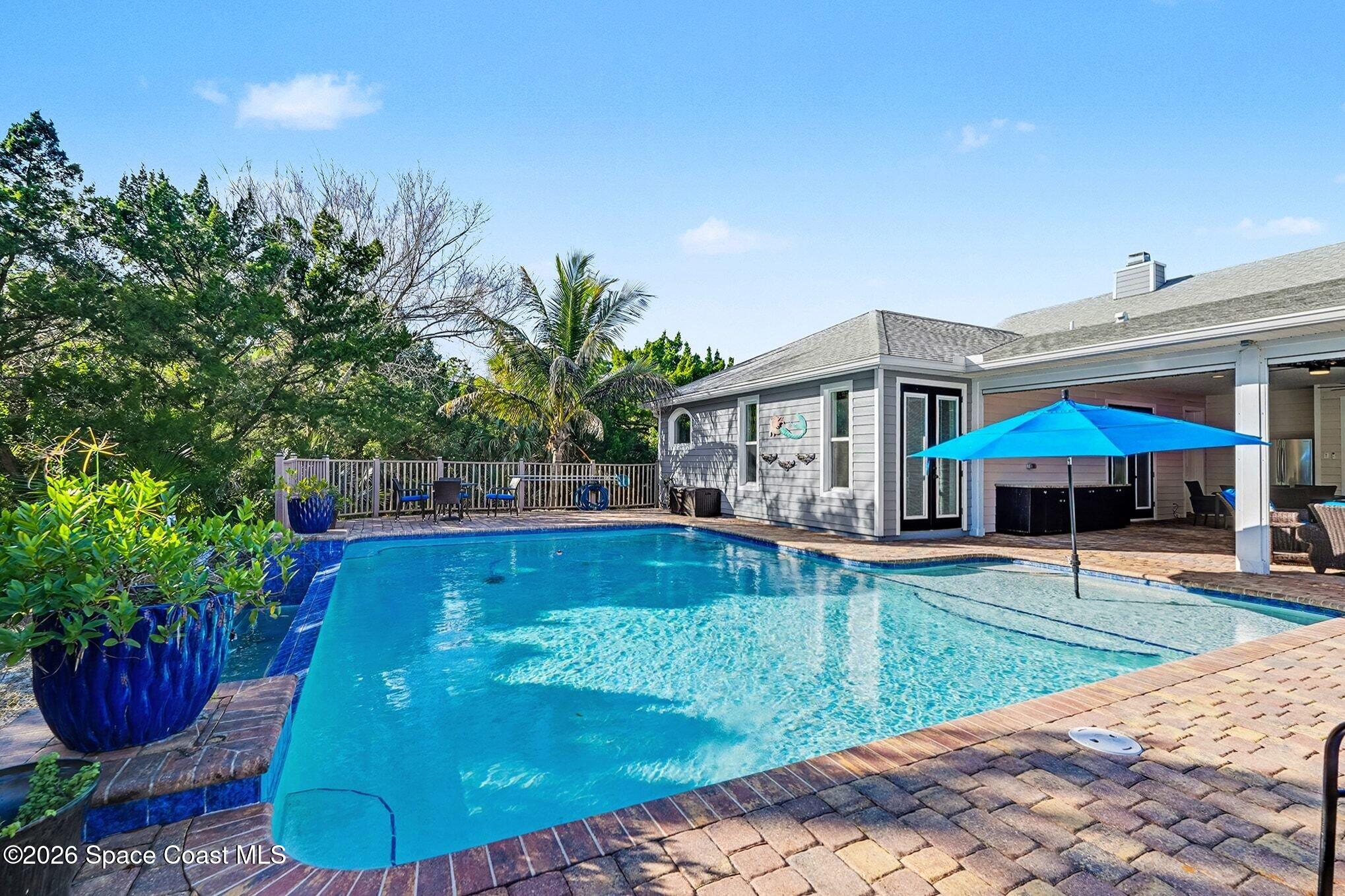1355 Dalbora Road Merritt Island, FL 32953 - Photo 2 of 37 a view of a house with swimming pool and sitting area