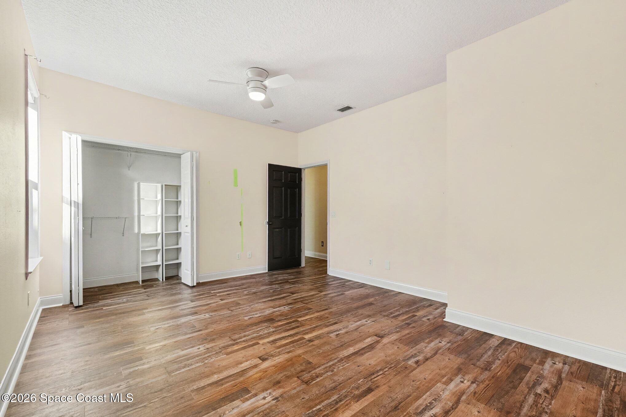 1355 Dalbora Road Merritt Island, FL 32953 - Photo 22 of 37 wooden floor in an empty room