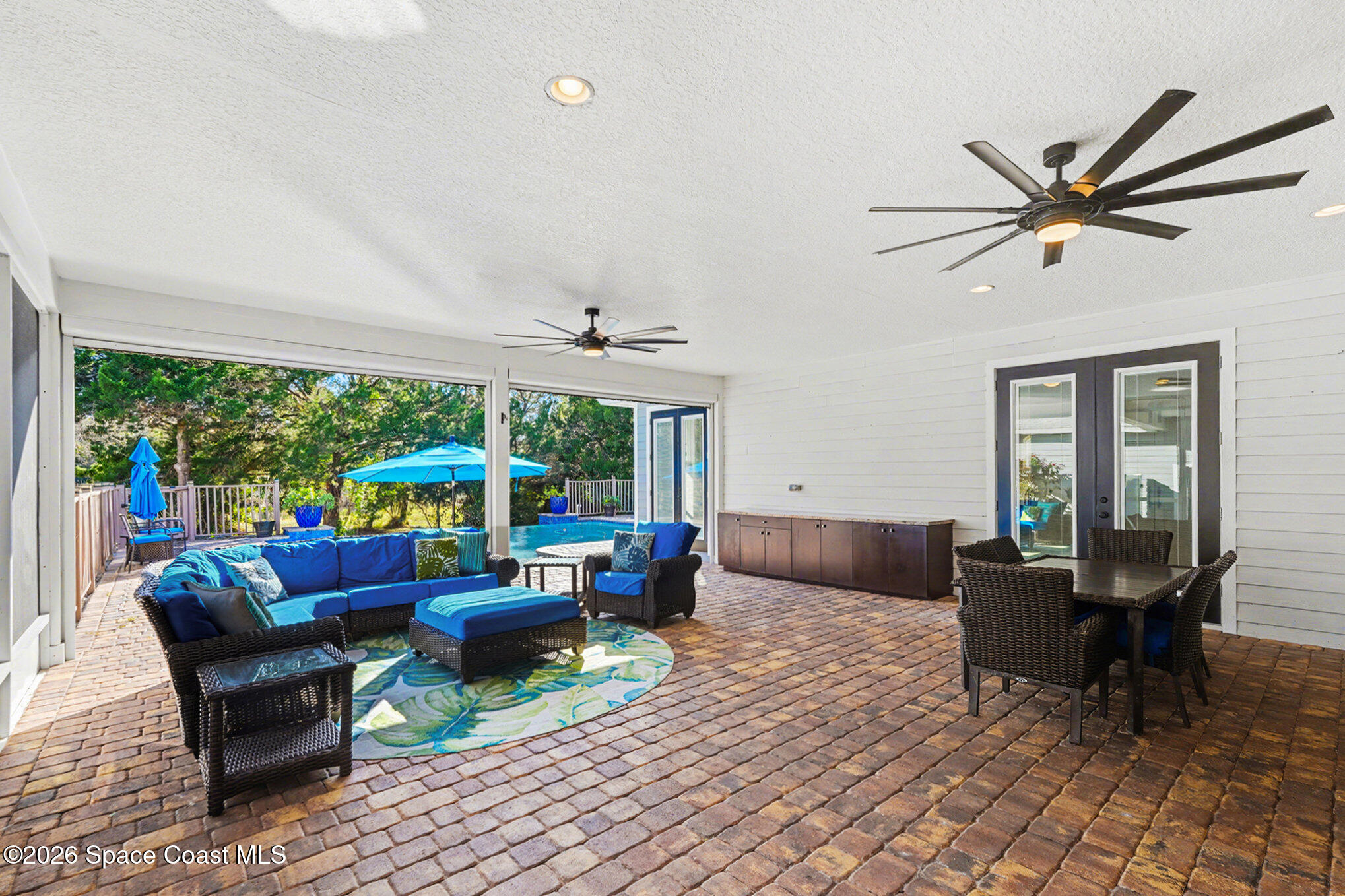 1355 Dalbora Road Merritt Island, FL 32953 - Photo 26 of 37 a living room with furniture and a large window