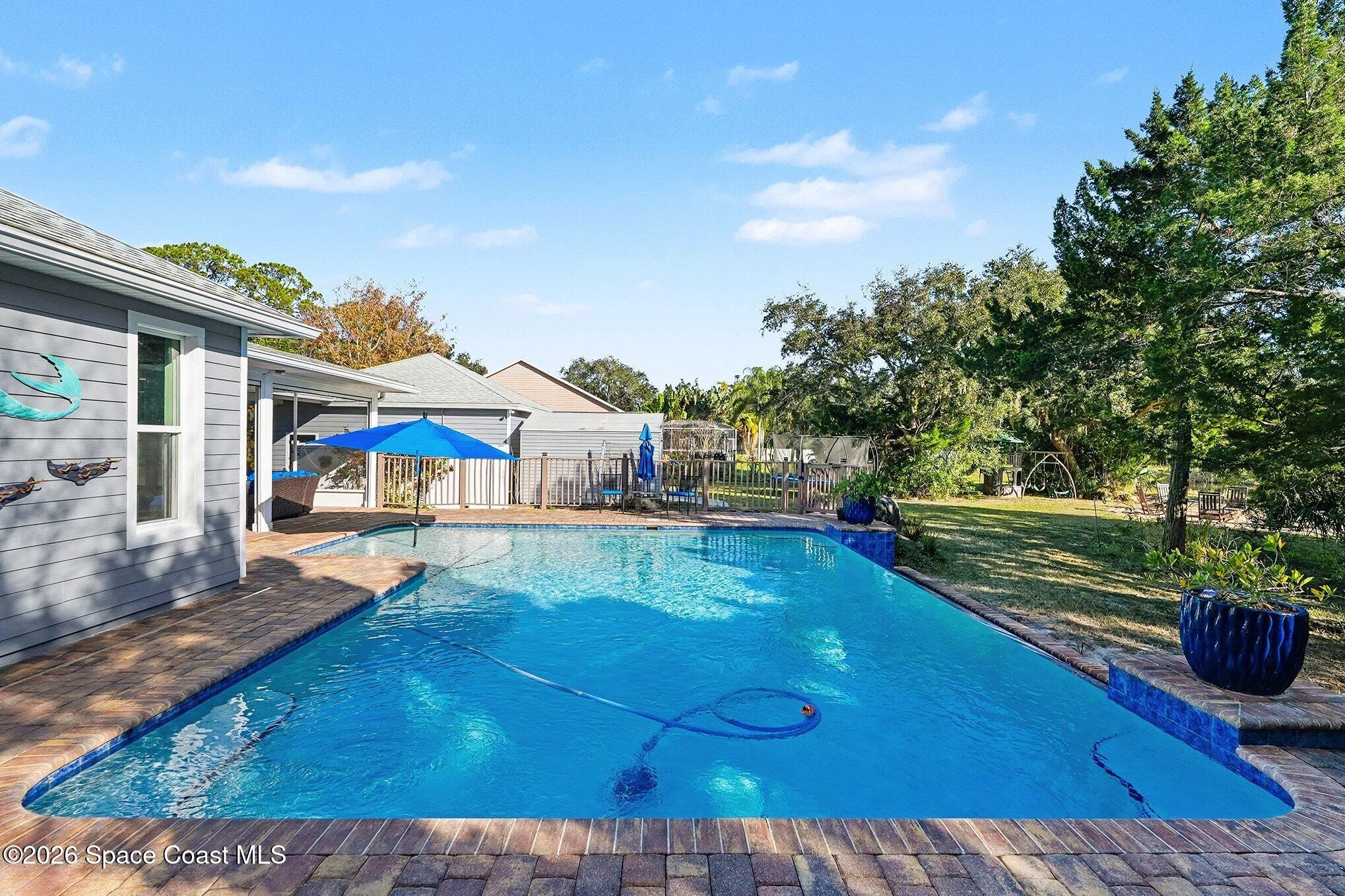 1355 Dalbora Road Merritt Island, FL 32953 - Photo 30 of 37 swimming pool view with a seating space