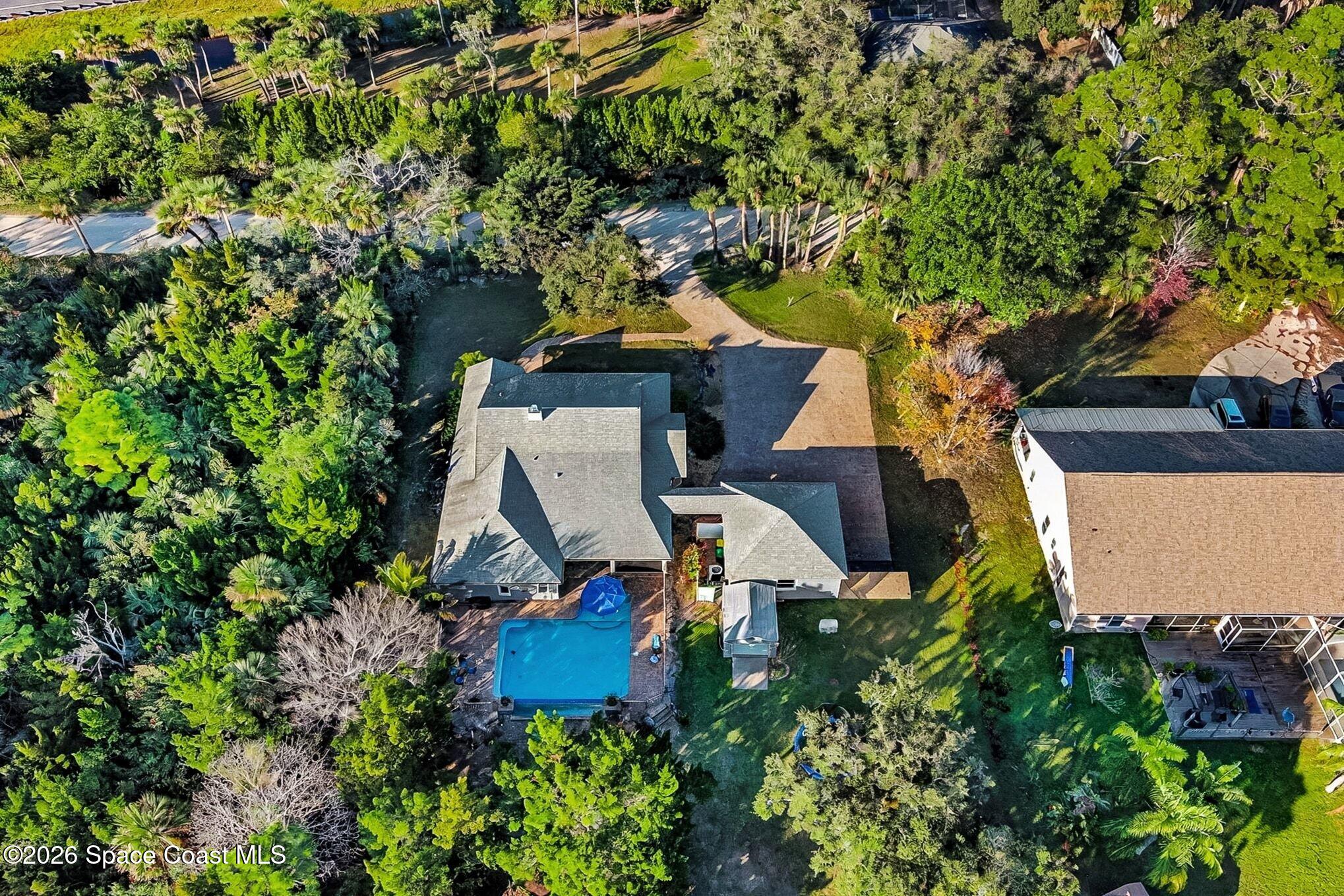 1355 Dalbora Road Merritt Island, FL 32953 - Photo 32 of 37 an aerial view of a house with outdoor space and sitting area