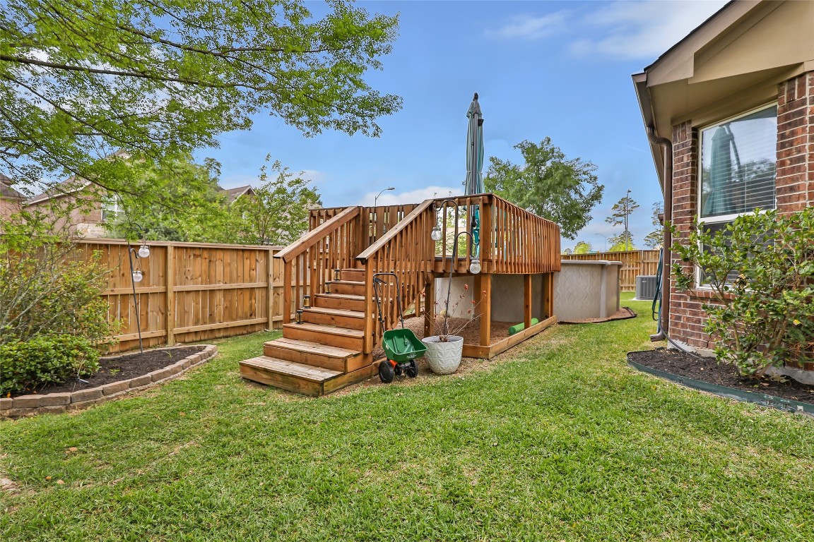 22202 Warm Terrace Lane Spring, TX 77389 - Photo 29 of 31 Above Ground pool with wood decking on side of backyard