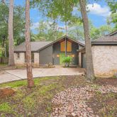 a view of a house with yard and garden