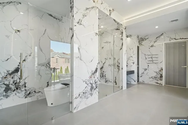 a spacious bathroom with a bathtub and shower