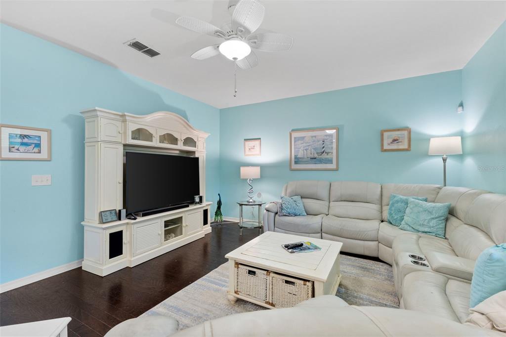3240 Macintosh Road Land O Lakes, FL 34639 - Photo 11 of 32 a living room with furniture and a flat screen tv