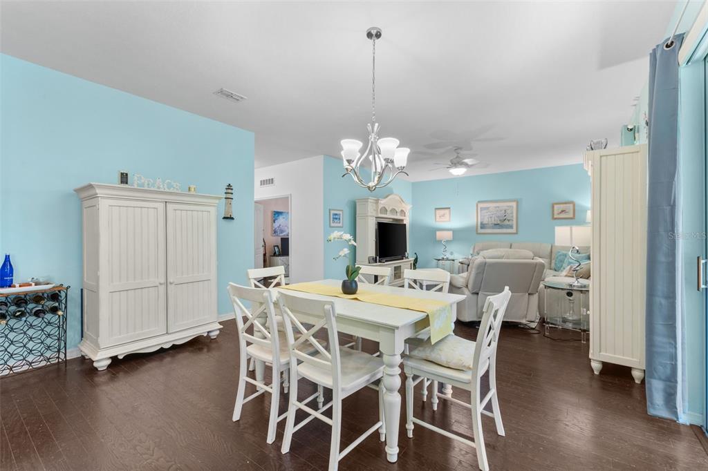 3240 Macintosh Road Land O Lakes, FL 34639 - Photo 13 of 32 a view of a dining room with furniture and chandelier