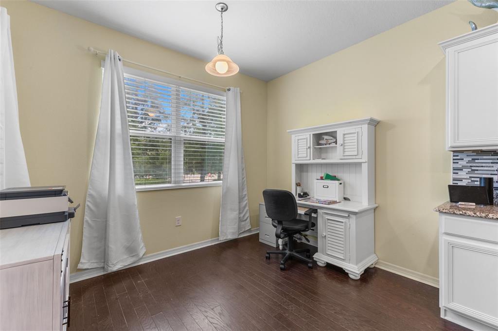 3240 Macintosh Road Land O Lakes, FL 34639 - Photo 14 of 32 a view of a workspace with furniture and a window