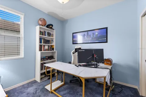 a view of a workspace with furniture