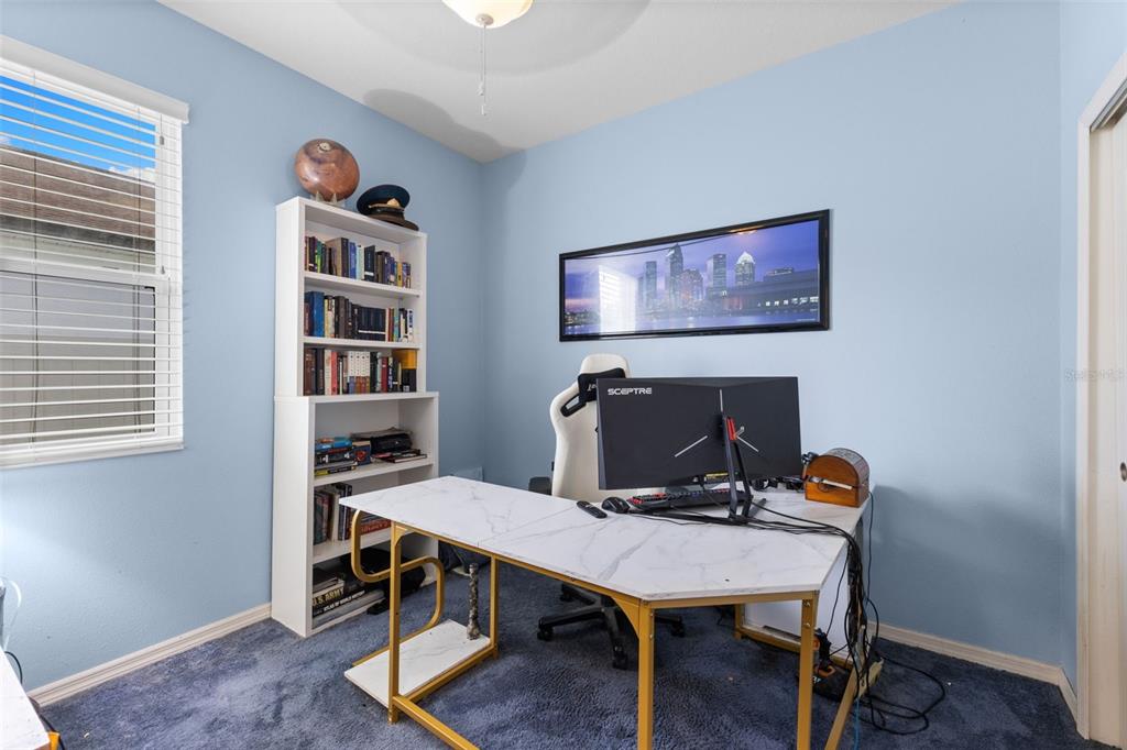 3240 Macintosh Road Land O Lakes, FL 34639 - Photo 23 of 32 a view of a workspace with furniture