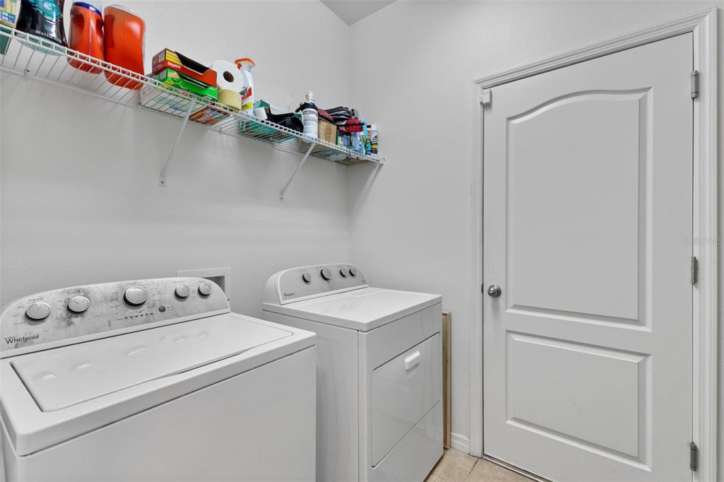 3240 Macintosh Road Land O Lakes, FL 34639 - Photo 24 of 32 a utility room with dryer and washer