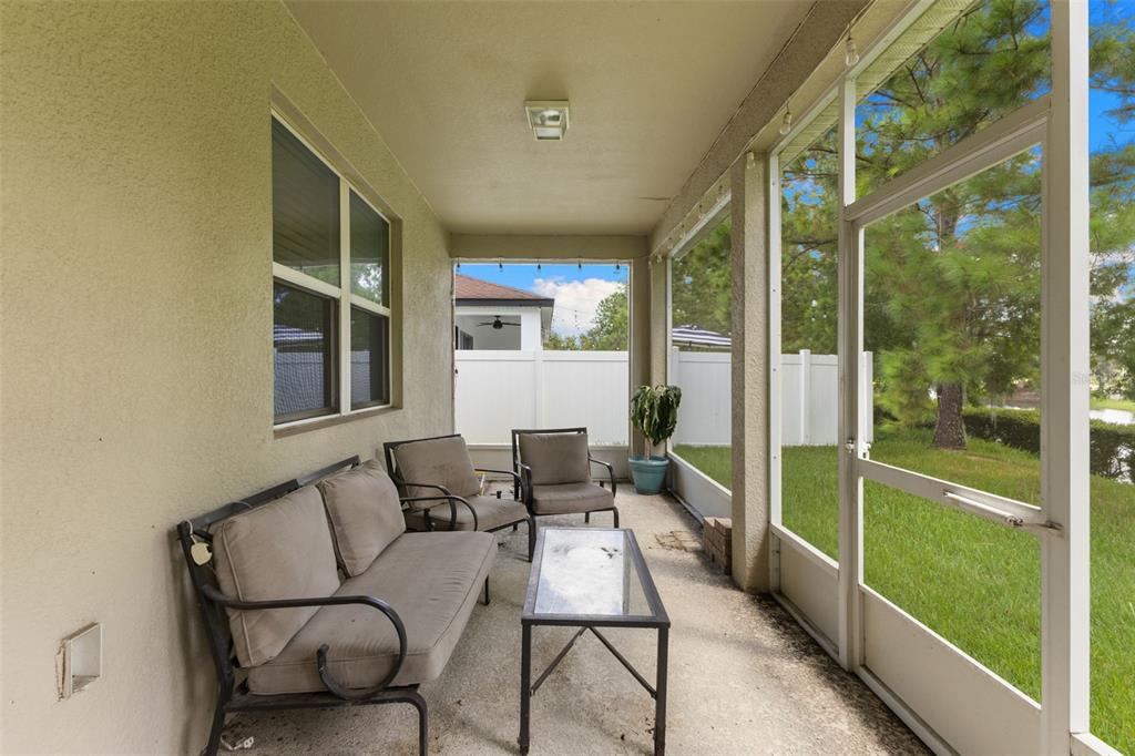 3240 Macintosh Road Land O Lakes, FL 34639 - Photo 26 of 32 a balcony with furniture and garden view