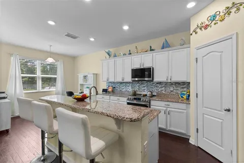 a kitchen with sink cabinets and window
