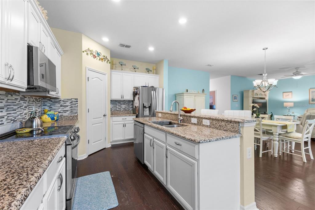 3240 Macintosh Road Land O Lakes, FL 34639 - Photo 4 of 32 a kitchen with lots of counter top space and stainless steel appliances