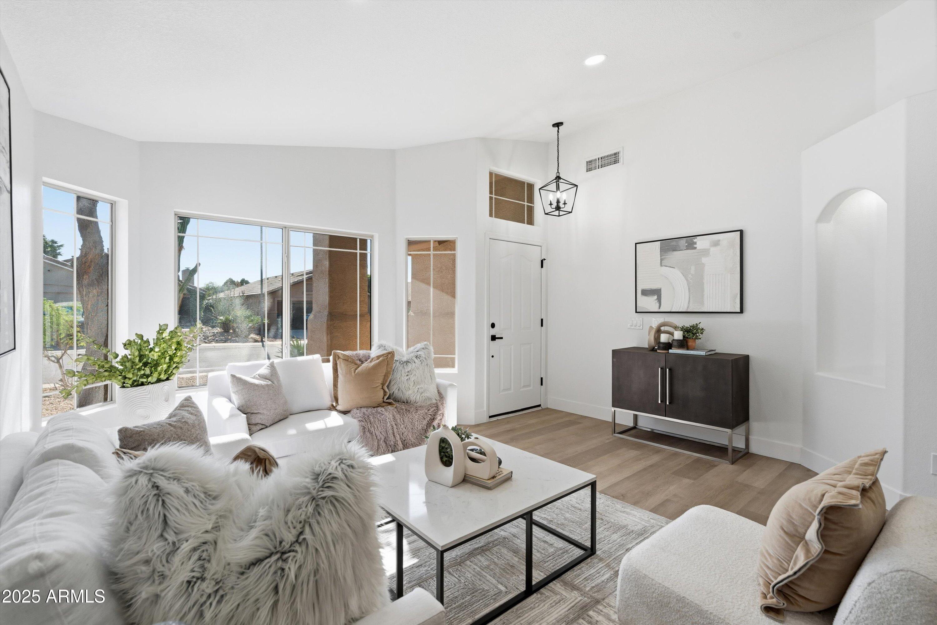 4438 East Rowel Road Phoenix, AZ 85050 - Photo 10 of 30 a living room with furniture and a large window