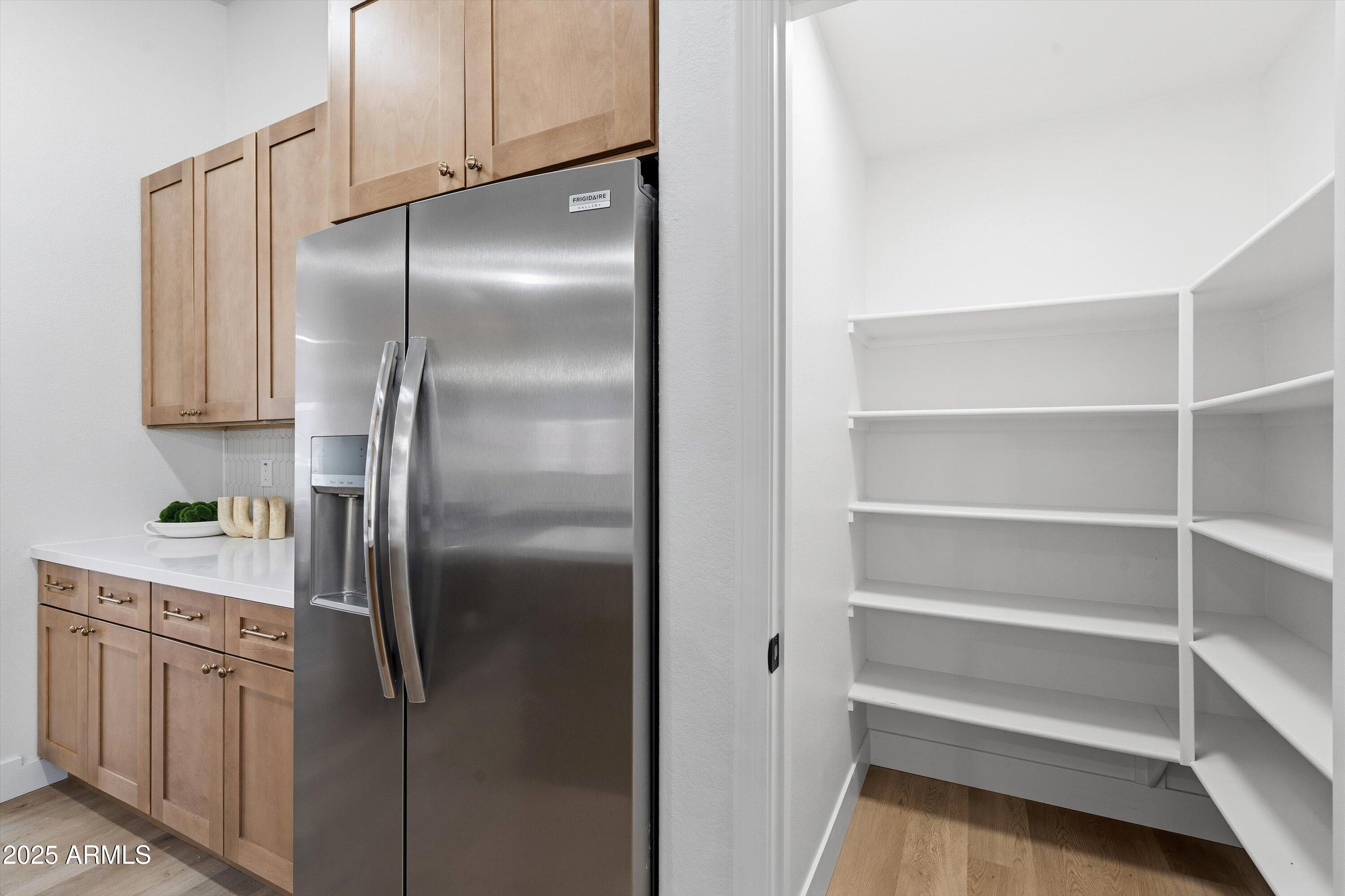4438 East Rowel Road Phoenix, AZ 85050 - Photo 14 of 30 a kitchen with cabinets and stainless steel appliances