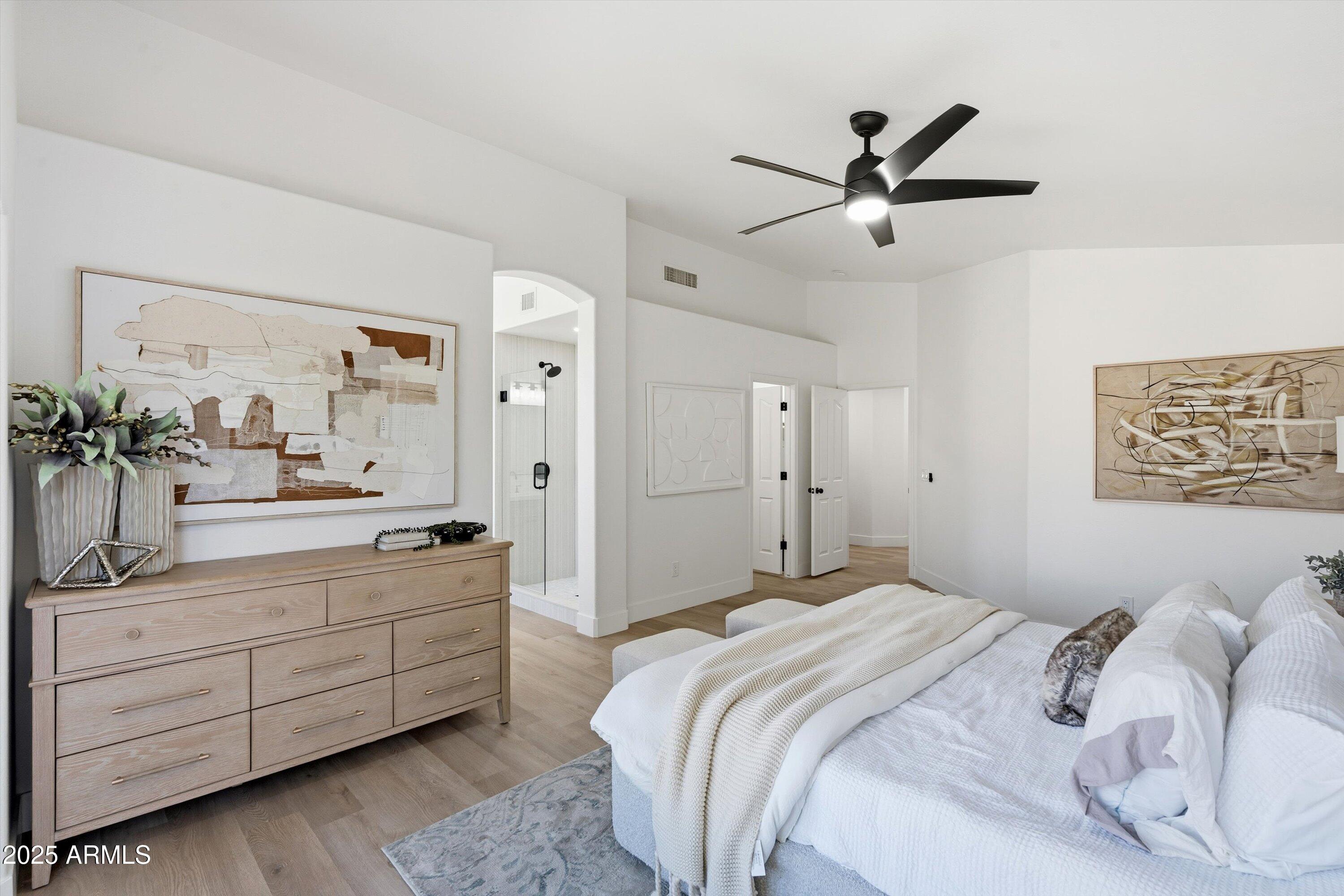 4438 East Rowel Road Phoenix, AZ 85050 - Photo 19 of 30 a bedroom with a bed and a dresser