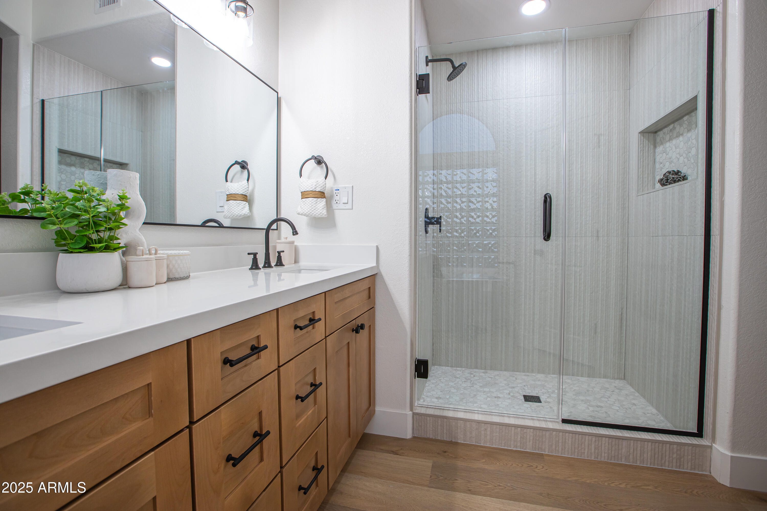 4438 East Rowel Road Phoenix, AZ 85050 - Photo 22 of 30 a bathroom with a shower sink and a mirror
