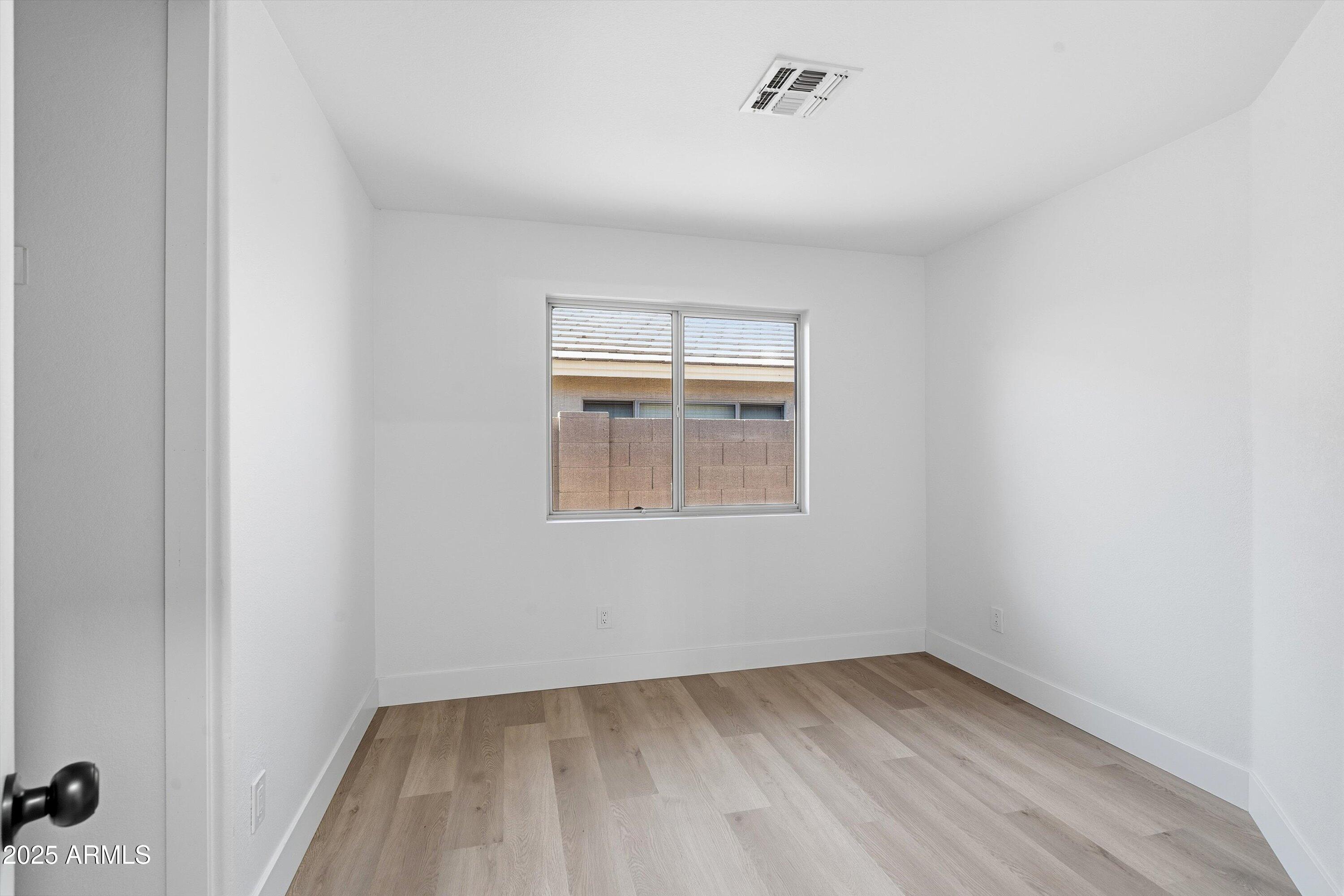 4438 East Rowel Road Phoenix, AZ 85050 - Photo 23 of 30 a view of an empty room with a window