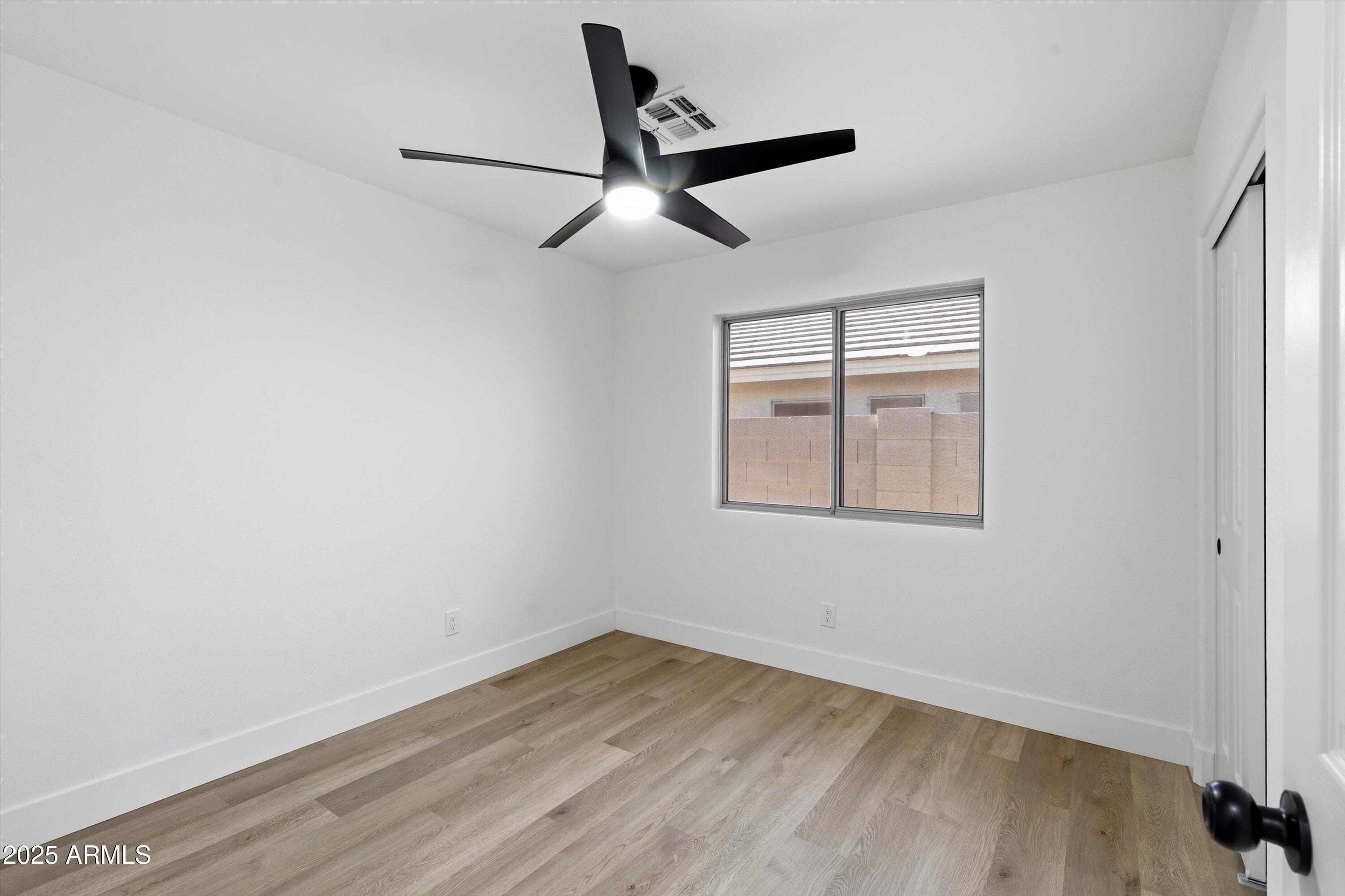 4438 East Rowel Road Phoenix, AZ 85050 - Photo 24 of 30 wooden floor in an empty room