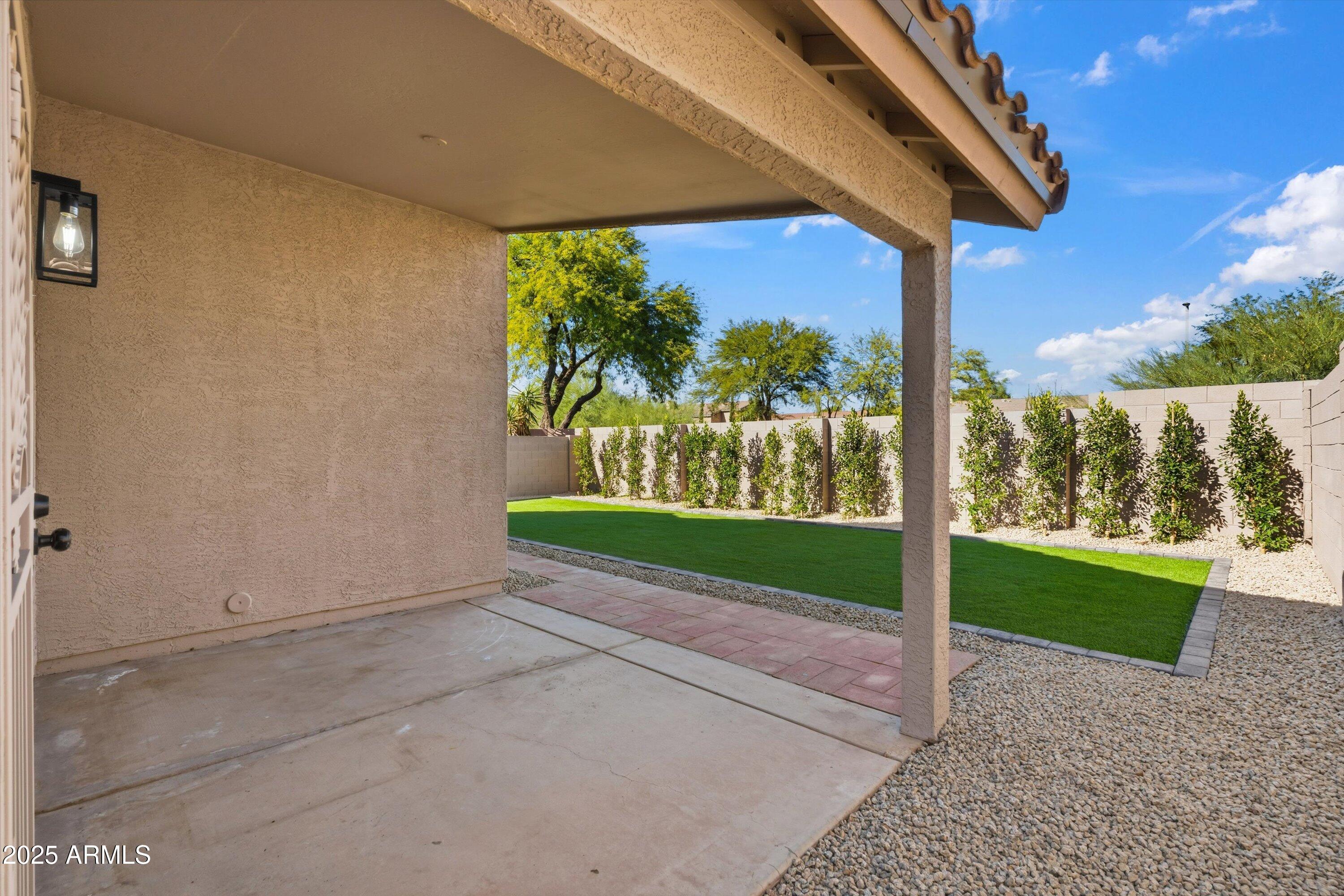 4438 East Rowel Road Phoenix, AZ 85050 - Photo 28 of 30 a view of backyard with plants and palm trees