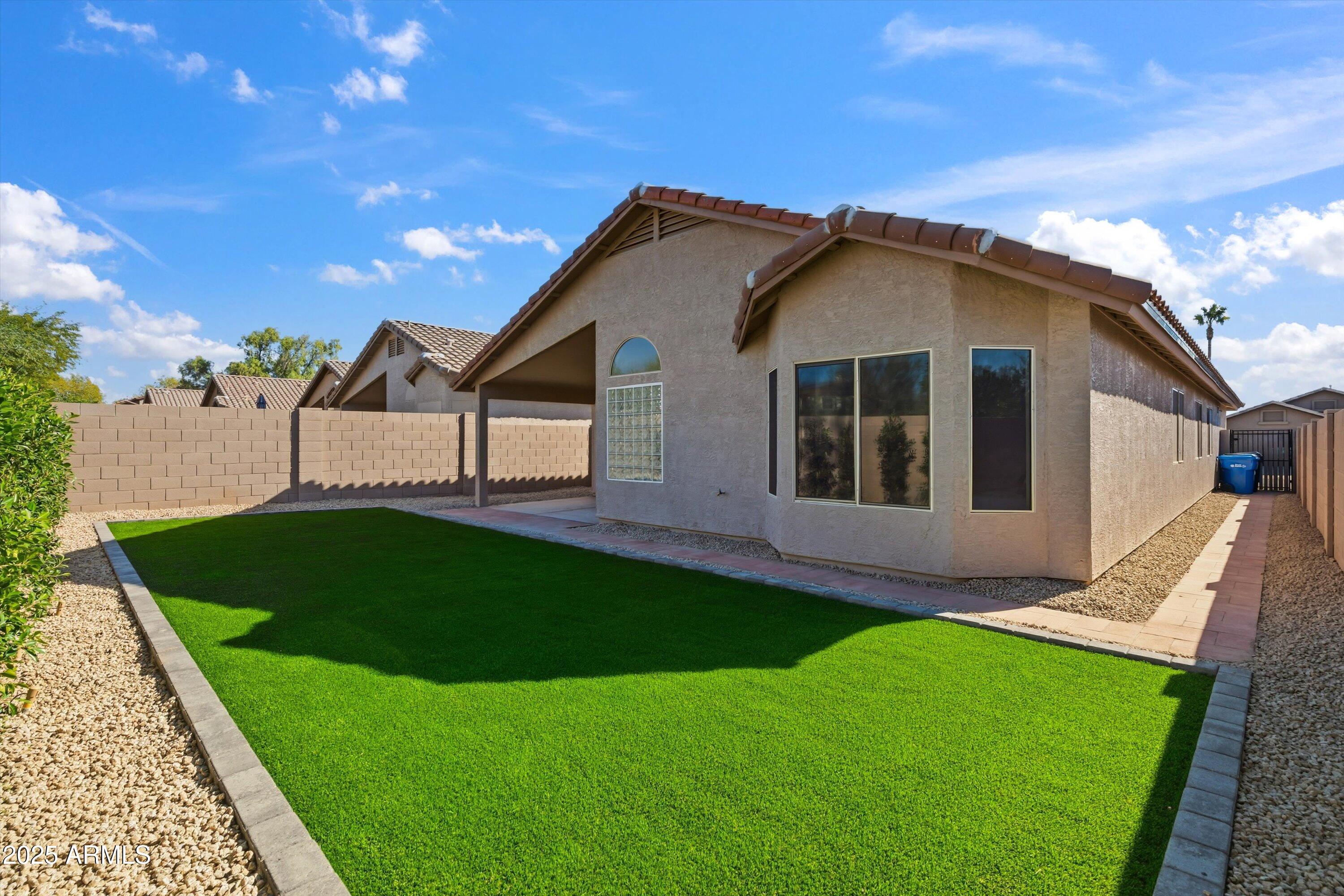 4438 East Rowel Road Phoenix, AZ 85050 - Photo 5 of 30 a view of a house with a yard