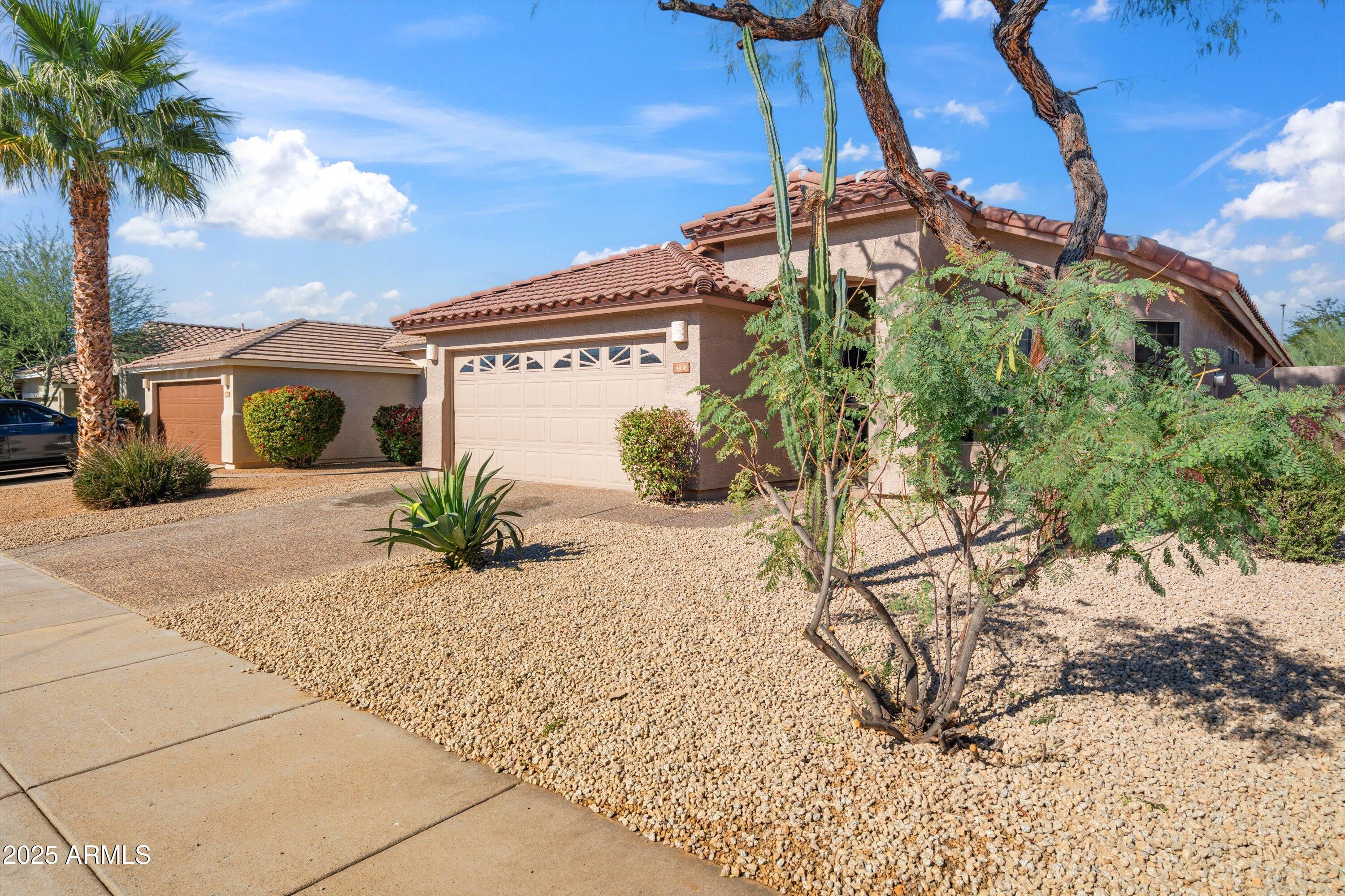 4438 East Rowel Road Phoenix, AZ 85050 - Photo 8 of 30 a front view of a house with a yard