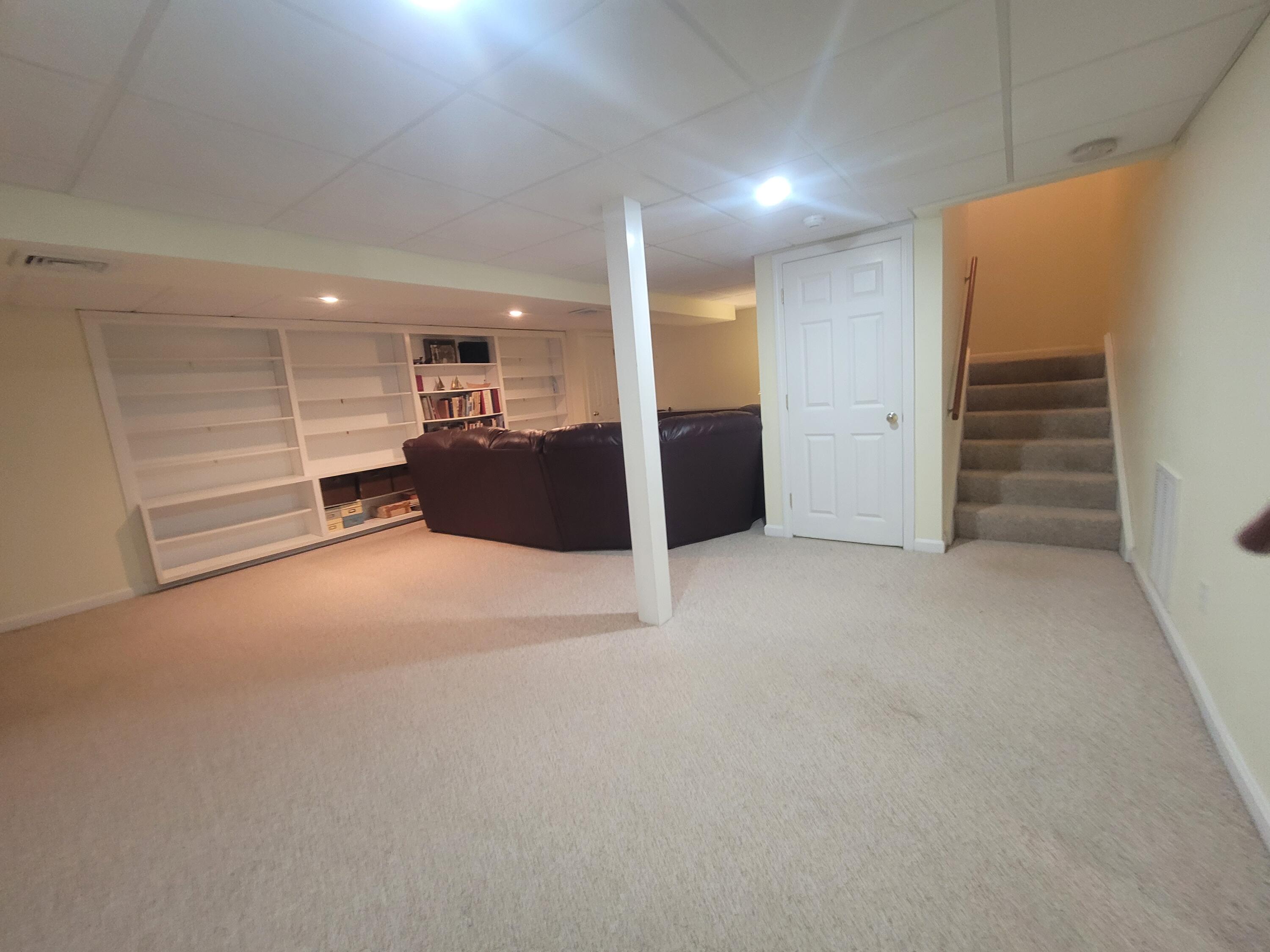105 Shellback Way, Unit P Mashpee, MA 02649 - Photo 13 of 29 a view of a big room with closet and cabinet