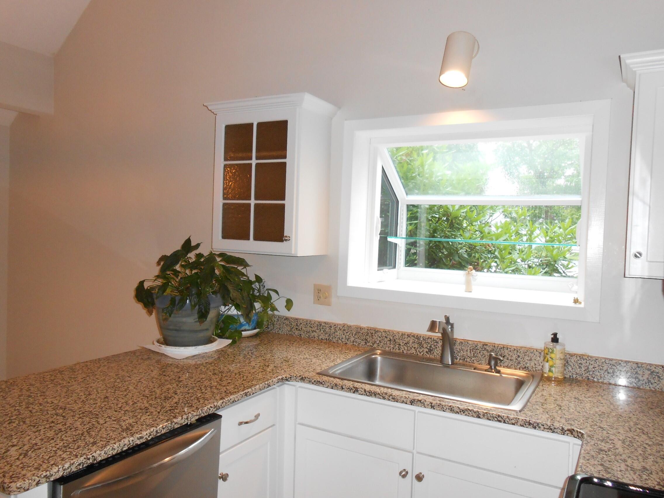 105 Shellback Way, Unit P Mashpee, MA 02649 - Photo 5 of 29 a kitchen with a sink a counter and window