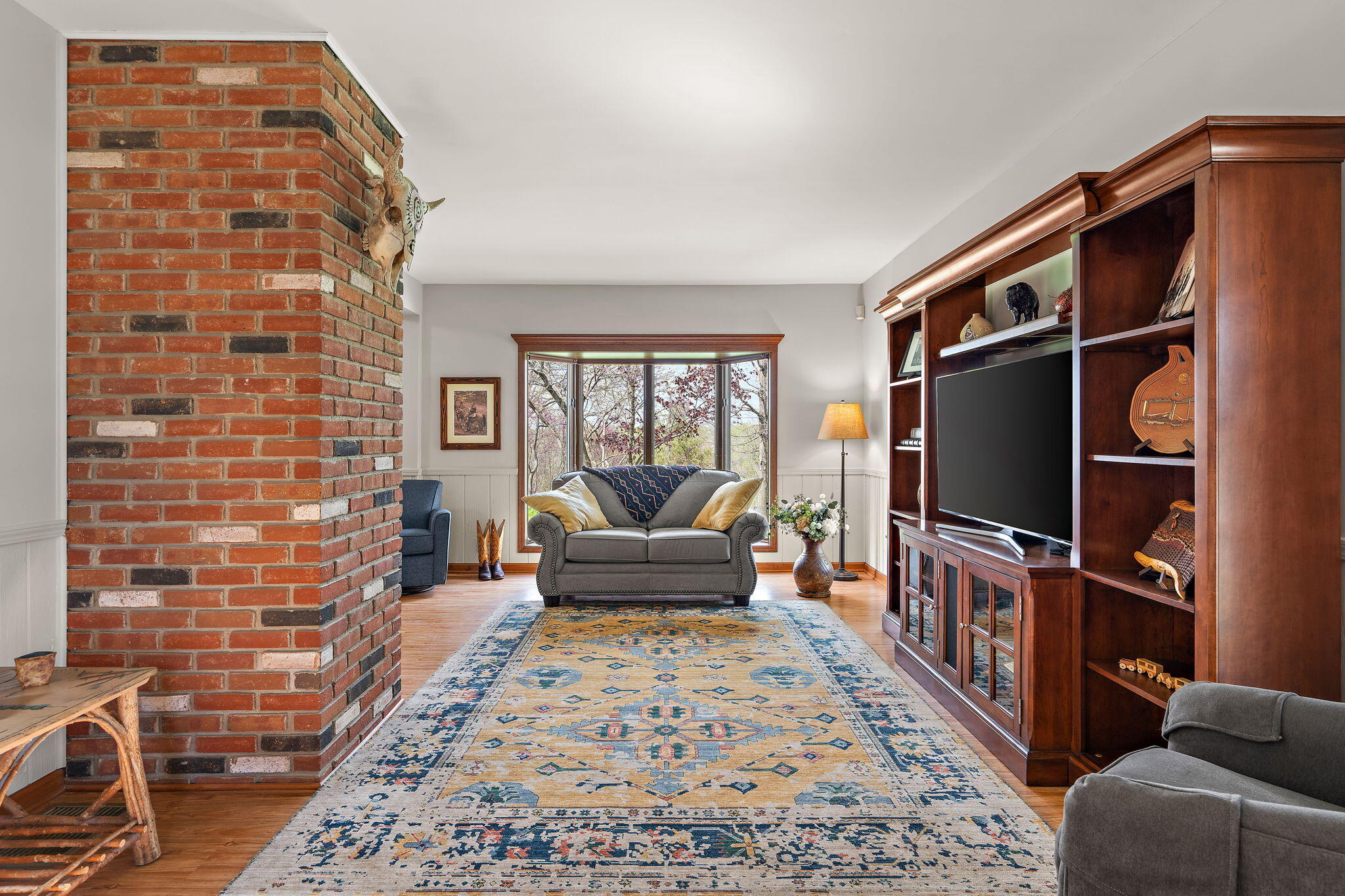 8 Smoke Road Valparaiso, IN 46385 - Photo 6 of 60 a living room with furniture a flat screen tv and a fireplace