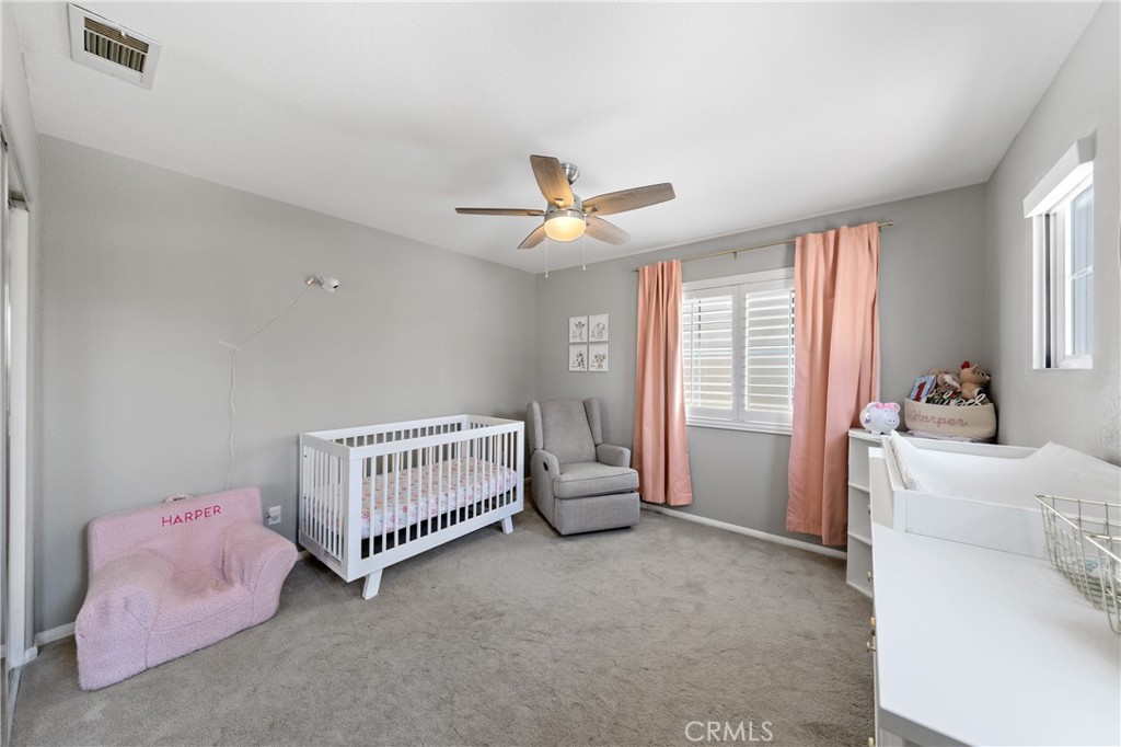32985 Novara Court Temecula, CA 92592 - Photo 32 of 56 Secondary Bedroom With Ceiling Fan And Soft Natural Light