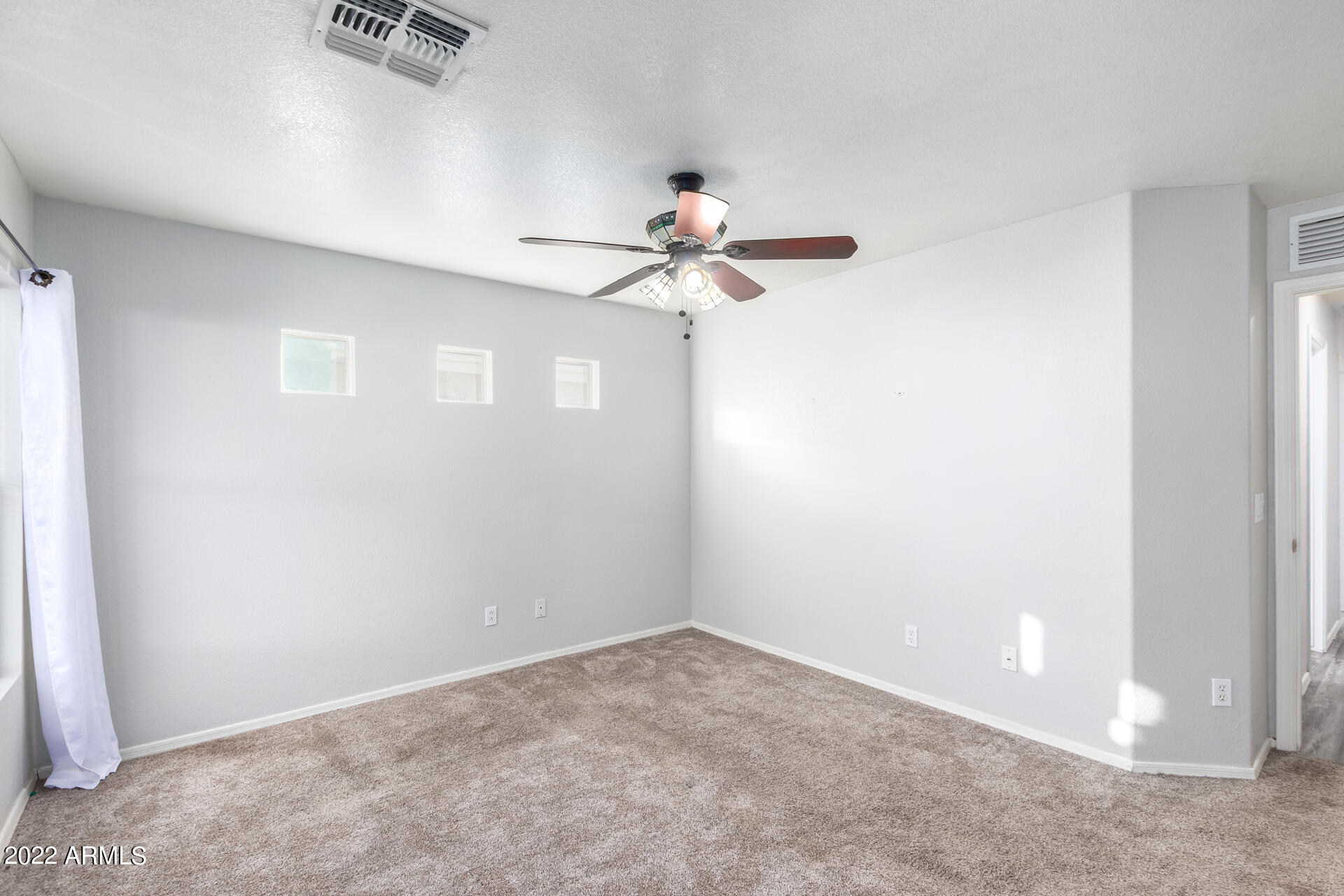 2609 South Devonna Lane Tolleson, AZ 85353 - Photo 15 of 30 a view of a chandelier fan in a room