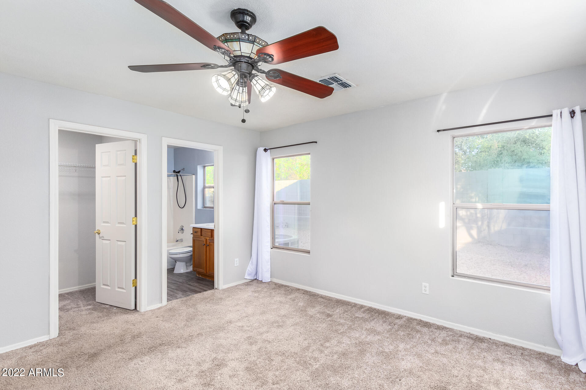 2609 South Devonna Lane Tolleson, AZ 85353 - Photo 17 of 30 wooden floor and chandelier fan in a room