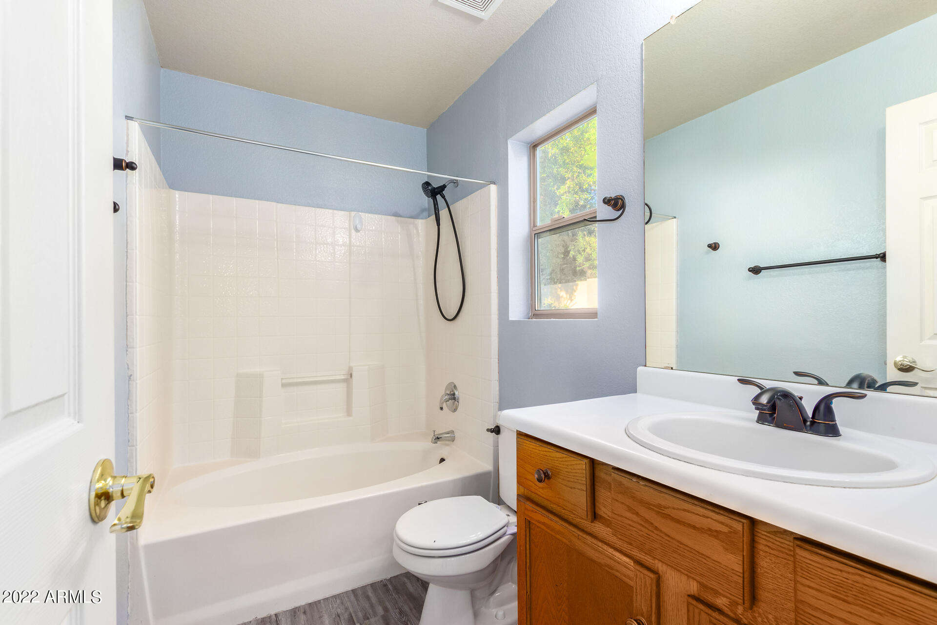 2609 South Devonna Lane Tolleson, AZ 85353 - Photo 18 of 30 a bathroom with a sink toilet and shower