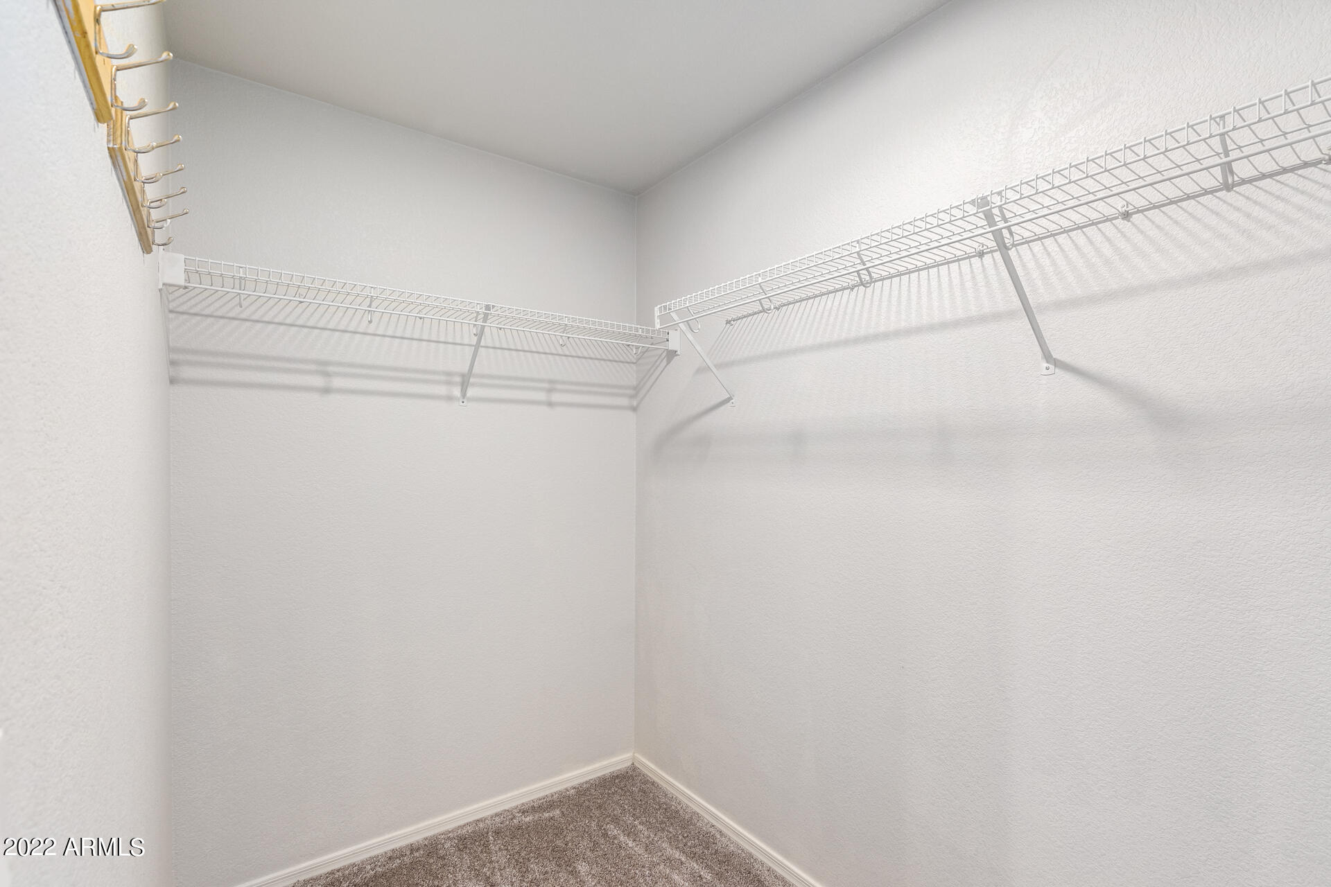 2609 South Devonna Lane Tolleson, AZ 85353 - Photo 19 of 30 a view of a room with racks on the wall